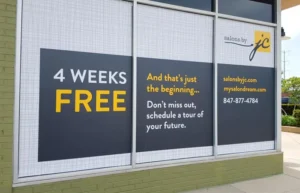 A '4 weeks free' window signage for a salon.