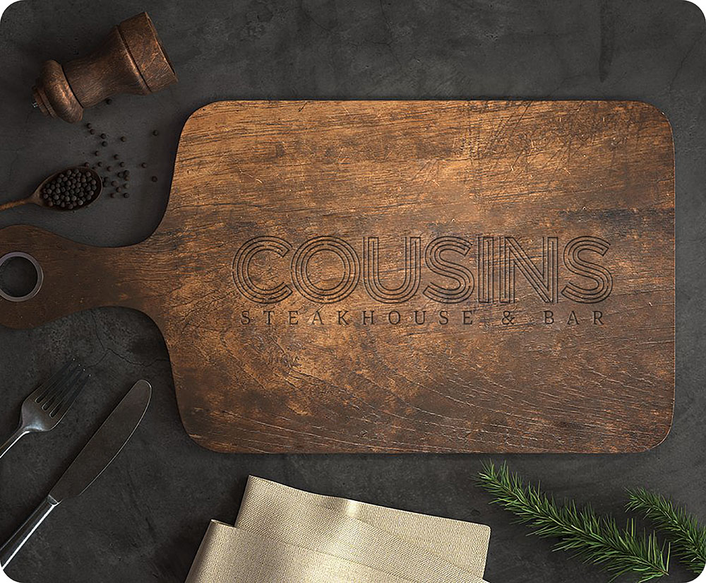 a wooden cutting board with a knife and fork