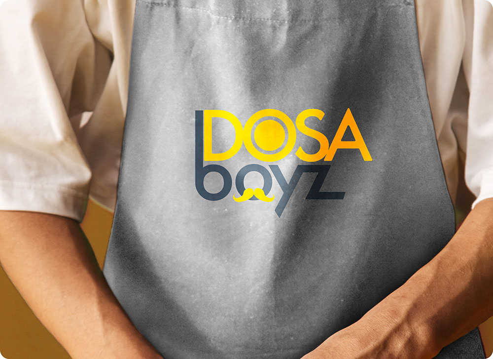 a person holding a grey apron