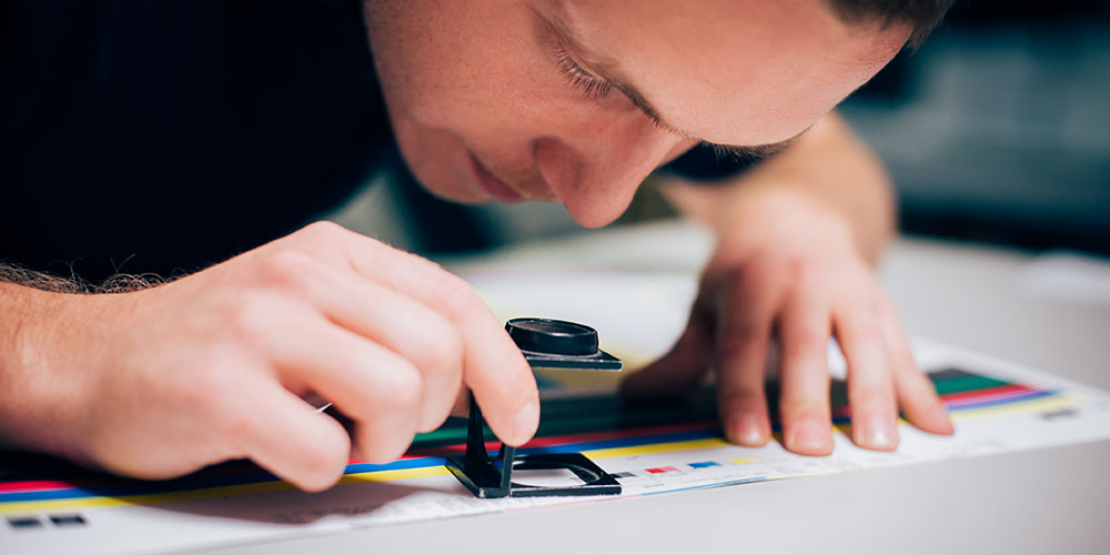 a man using a magnifying glass