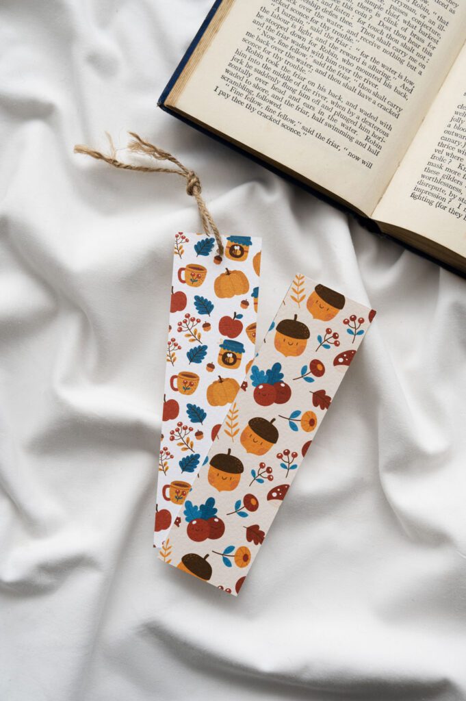 bookmarks with a pattern on them next to a book