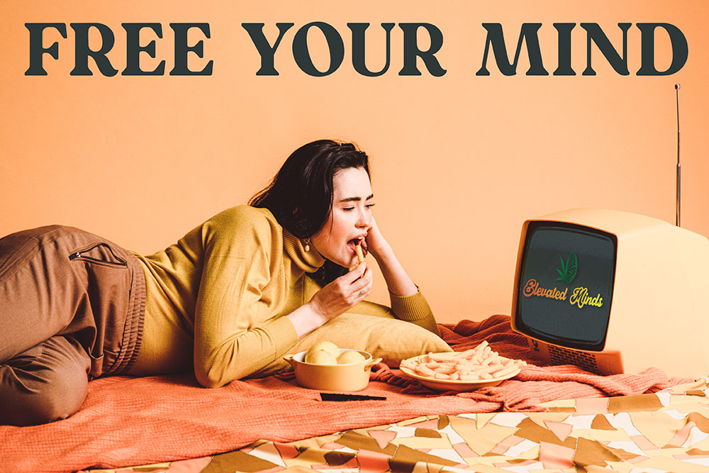 a woman lying on a bed eating food and a tv