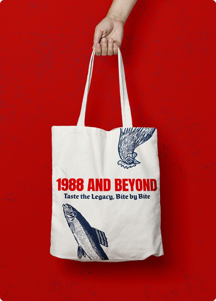 a hand holding a white bag with fish and a bird on it