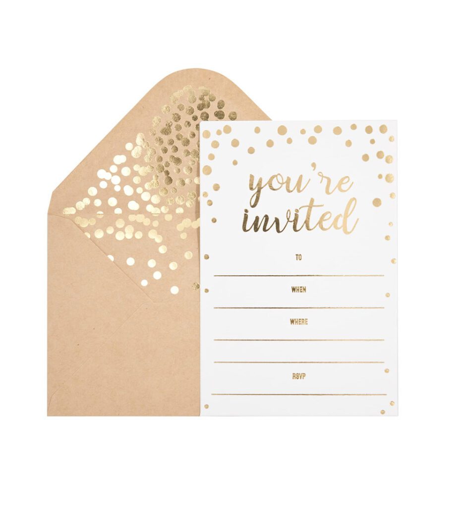 a white card with gold foil on it and a brown envelope