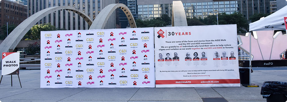 a group of signs on a sidewalk
