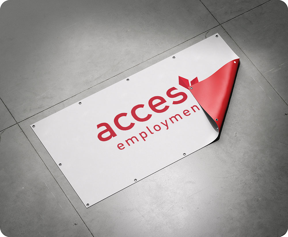 a white sign with red writing on it