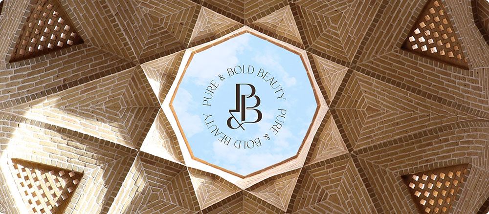 a circular design with a sky view through a brick ceiling