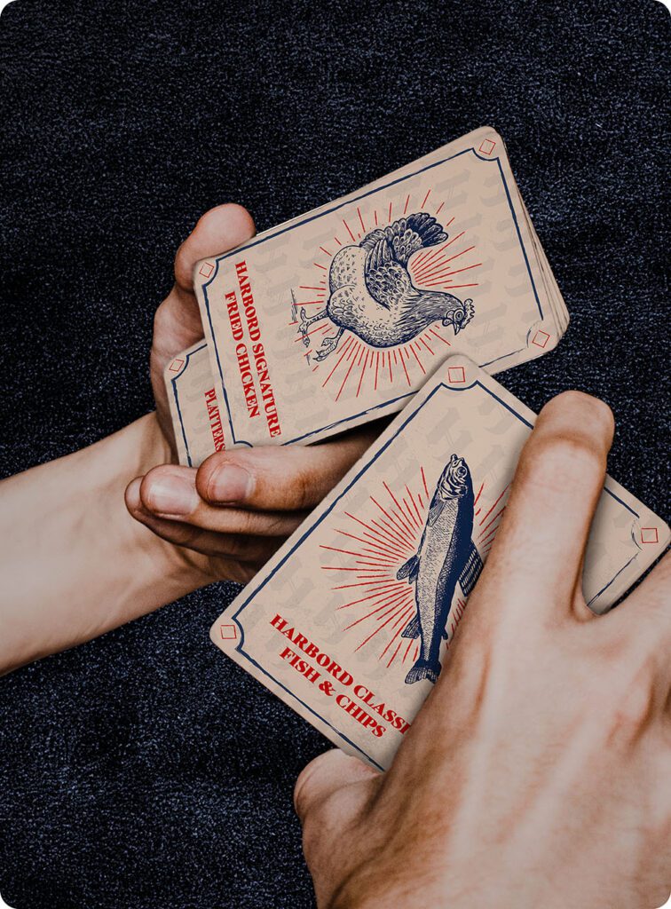 a person holding playing cards
