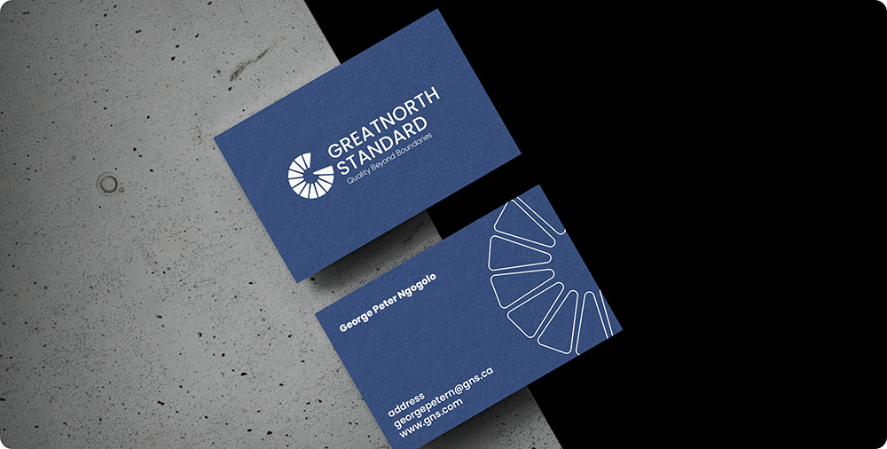 two blue business cards on a black and white surface