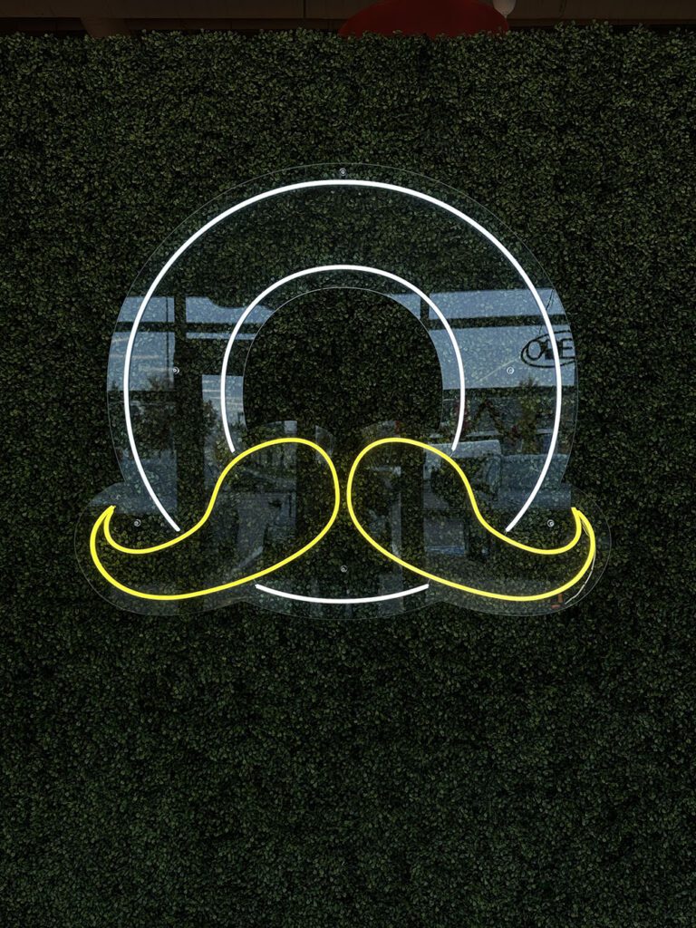 a yellow and white logo on a black background