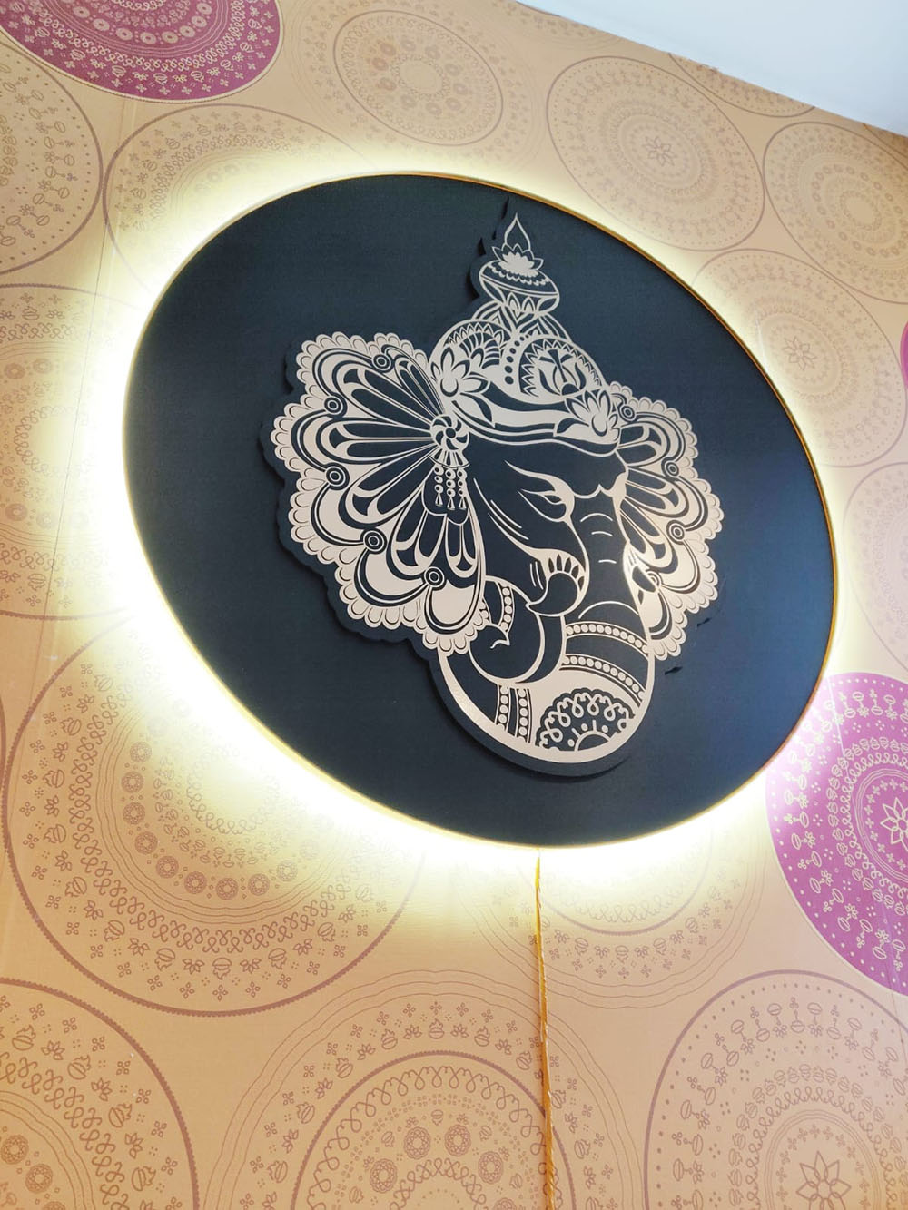 a circular wall with a picture of an elephant