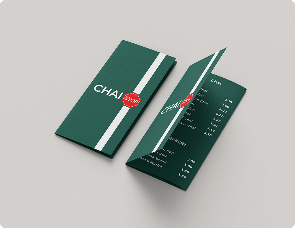 a green and white folded menu